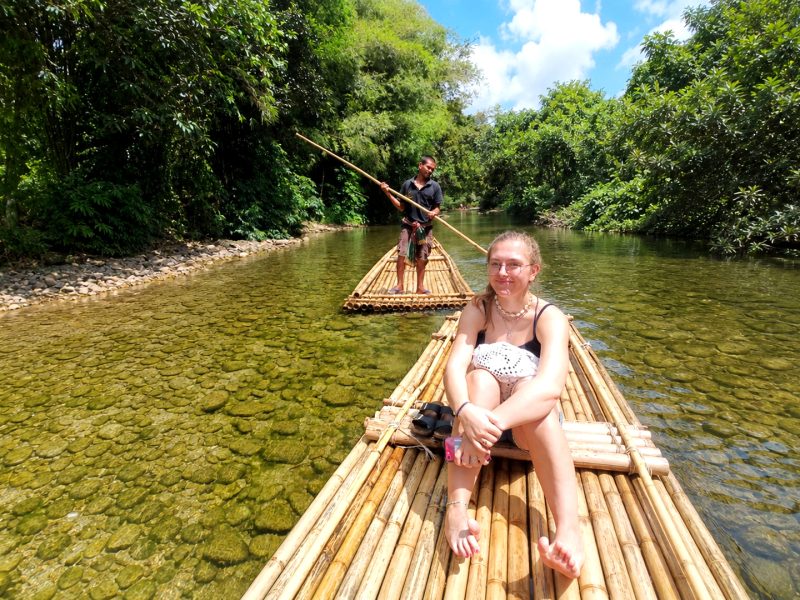 Guest enjoying a bamboo rafting experience on a tropical river in Khao Lak