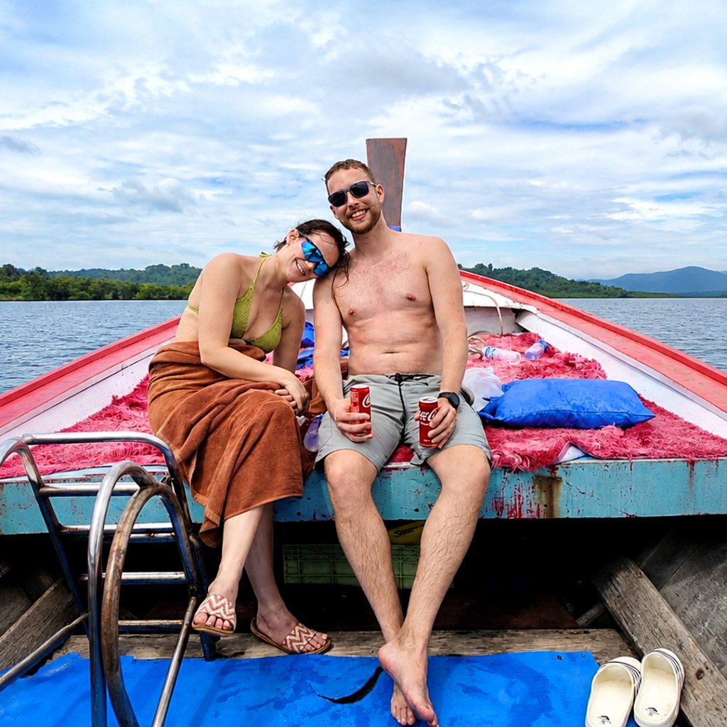 Couple relaxing on a local longtail boat near Khao Nayak
