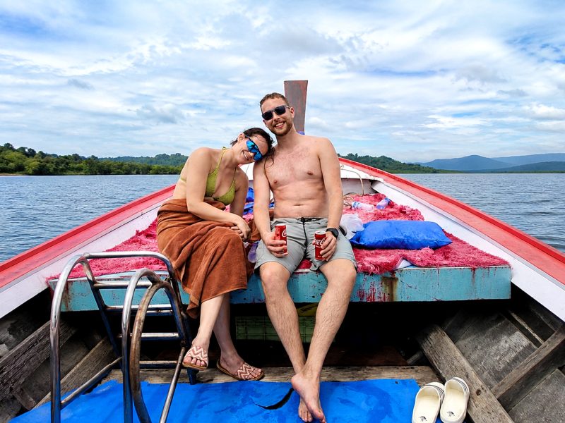 Couple relaxing on a local longtail boat near Khao Nayak