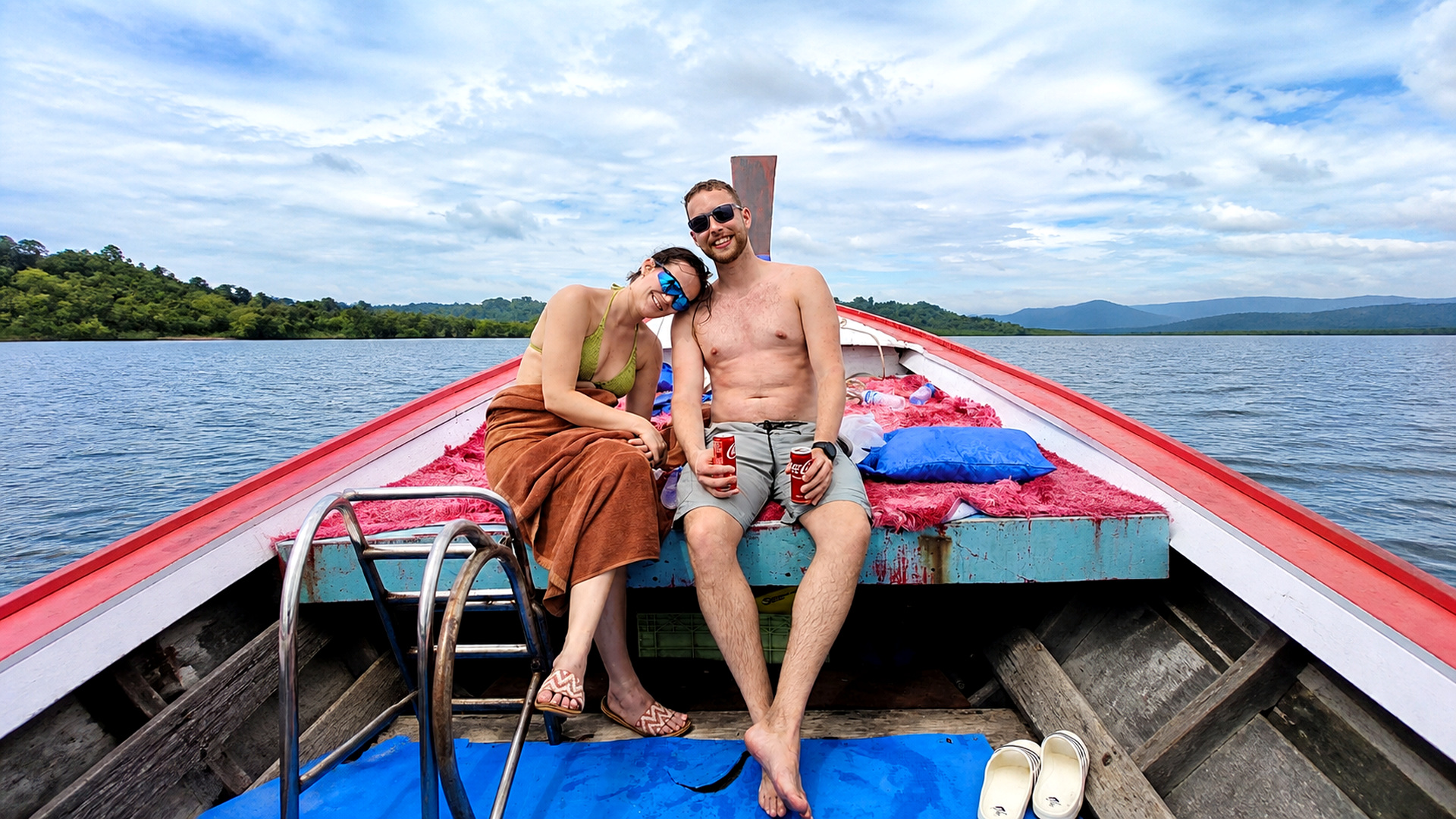 Couple relaxing on a local longtail boat near Khao Nayak
